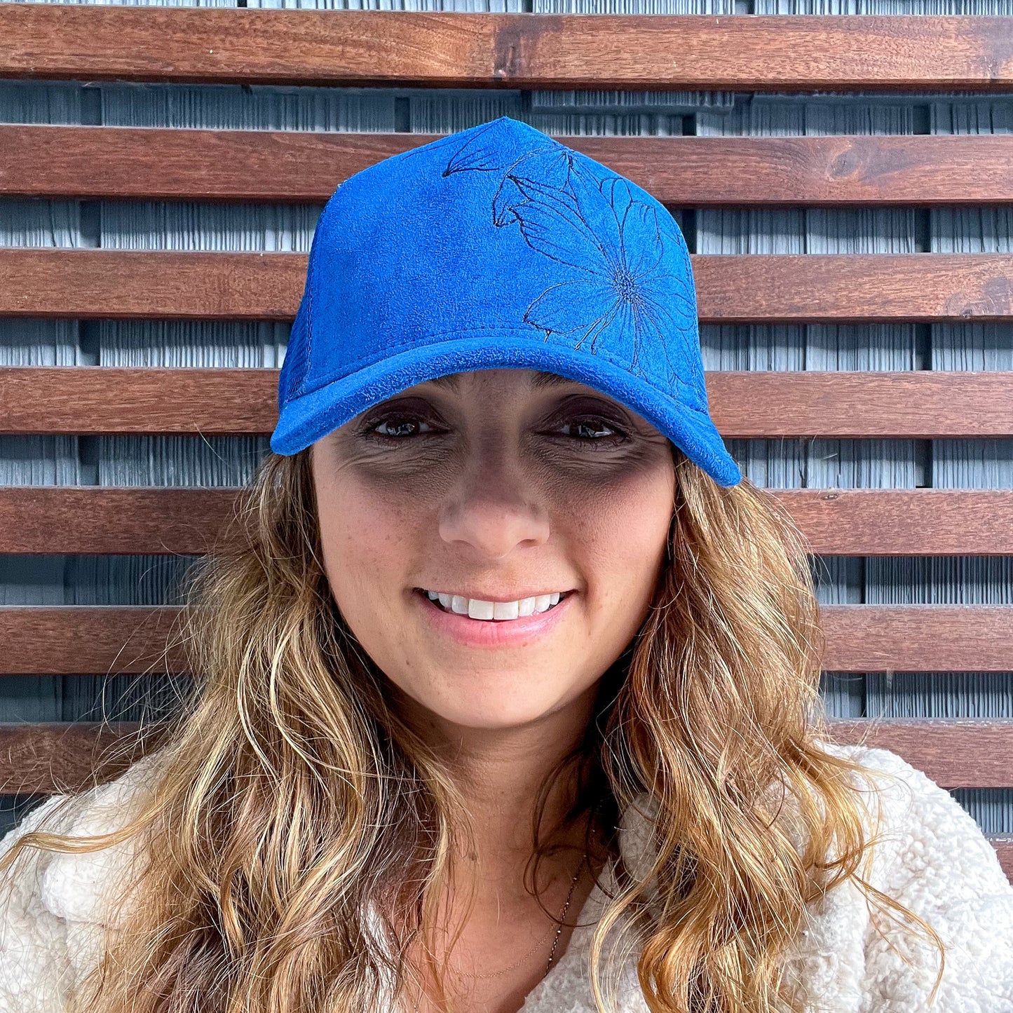 Suede Blue Burned Daisy Floral Trucker Hat