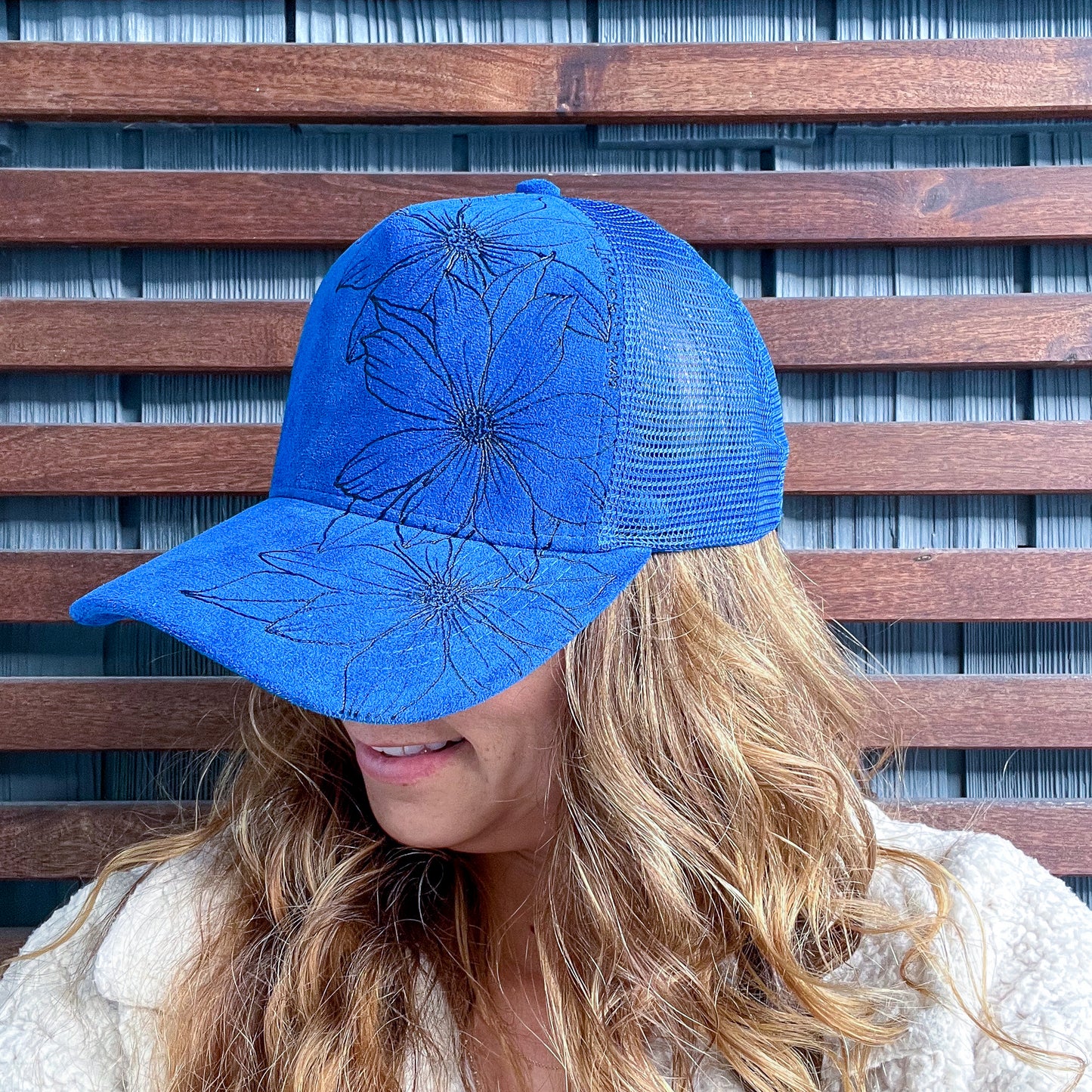 Suede Blue Burned Daisy Floral Trucker Hat